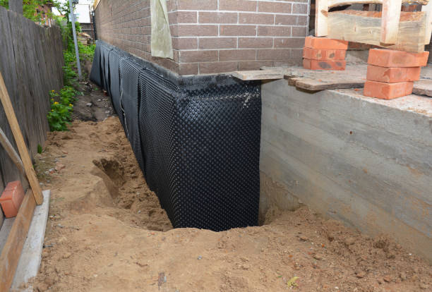 Happy homeowners after waterproofing job in Prospect